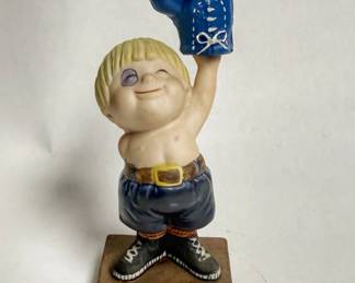 Vintage 1980 Enesco "Little Rocky" boxing boy figurine holding a blue boxing glove.