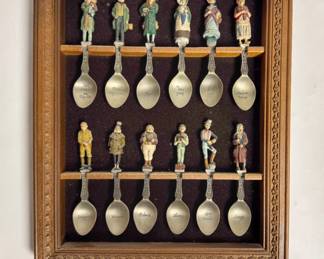 Vintage 1981 Franklin Mint Charles Dickens Pewter Spoon Collection, which includes 12 hand-painted pewter character spoons mounted in an ornate wooden wall-hanging display case.