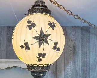 Vintage mid-century modern hanging globe swag lamp (Turned on).