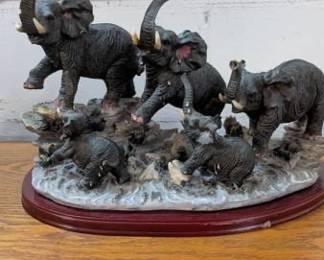 Elephant Family Sculpture on Wood Base