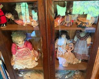 Curio Cabinet with Assorted Dolls