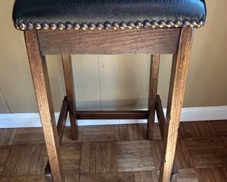 Rustic Wood Bar Stool with Nailhead Trim and Dark Upholstery