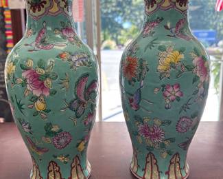 A pair of Chinese porcelain vases, Jiaqing seal mark, famille rose decorated with butterfly and floral design, between bands of lappets