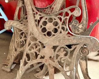 Two sets of cast iron bench ends 