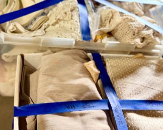 Bundles of vintage linen. One price for an entire tub. 