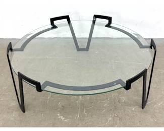Lot 626 After Jean Royere Gilt Iron and Glass Cocktail Table. Round glass top rests in stylish 3 leg frame w
