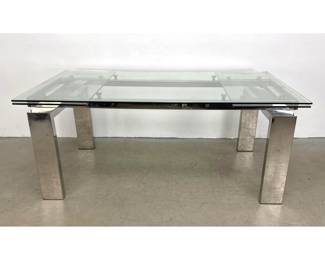 Lot 535 Modern polished chrome and glass extendable dining table with lateral leaves and block legs. Unmarke
