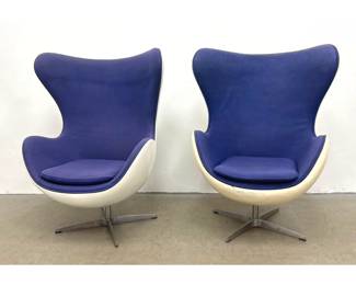 Lot 279 Pair of Mid Century Modern Style Egg Chairs. Swiveling High Back Lounge Chairs with White Fiberglass