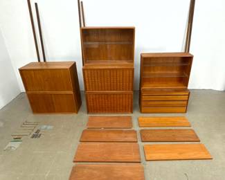 Lot 590 Danish Modern Cado Wall Shelf Unit. 6 uprights. 2 drop desks. 2 wood sliding cabinets. 2 glass slidi