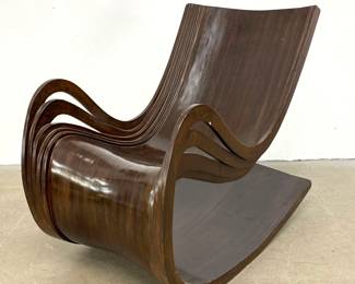 Lot 524 Modernist Sculptural Laminated Bentwood Rocking Chair with Ribbon Armrests and Wenge Finish. Heavy c