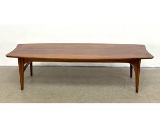 Lot 356 Mid Century Modern walnut surfboard coffee table featuring sculptural arched stretchers and tapered 
