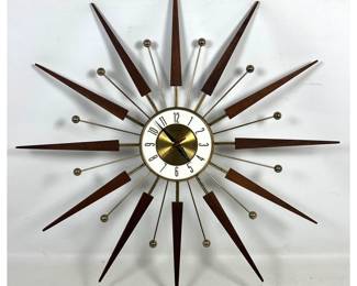 Lot 173 ELGIN Mid Century Modern Starburst Wall Clock. Wood and Brass Toned Rays. Battery OP. Marked ELGIN. 