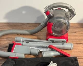 Black & Decker FlexAuto 12V handheld vacuum cleaner with attachments