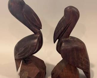 Hand-carved wooden pelican sculptures