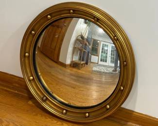 Convex bullseye mirror in a gilded frame