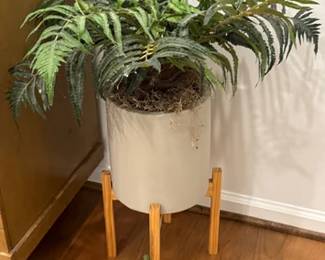 Large faux plants in pots and on stands