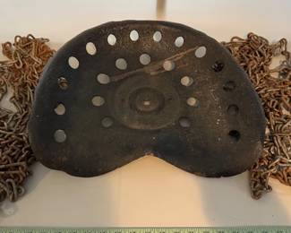 Vintage tractor seat and two snow chains