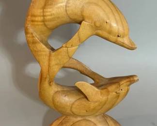 Carved wooden double dolphin sculpture