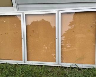 Two separate enclosed 3-door cork bulletin board with silver aluminum frame