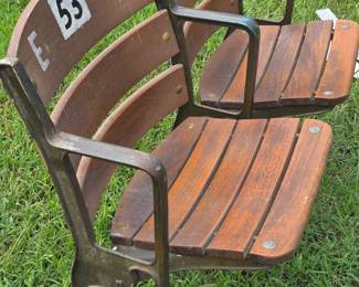 Several sets of vintage wooden stadium seats
