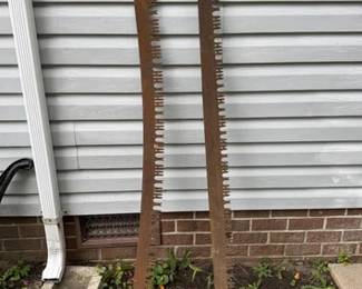 Two vintage two-man crosscut saws