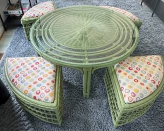 Glass top wicker cocktail table and four benches