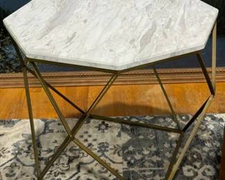 Faux marble top table with a metal base