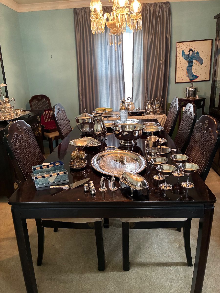 great selection  of silver and lovely dining room table with 8 chairs 