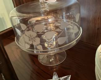 Glass dome cake plate and star-shaped candle holders
