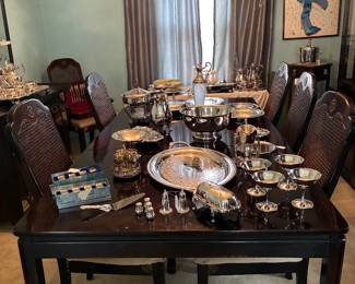 great selection  of silver and lovely dining room table with 8 chairs 