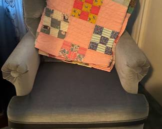 Fabric rocker chair and vintage quilt