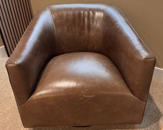 Brown Leather Swivel Barrel Back Armchair. Measures 31” W x 33” D. Photo 1 of 3.