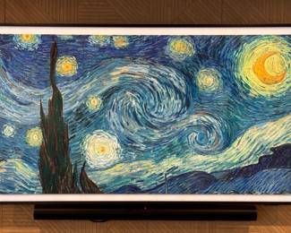 Samsung The Frame TV. Measures 66” W x 38” H.