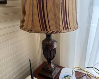 Bronze urn-form table lamp with striped fabric shade