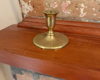 Small brass candlestick holder with round base