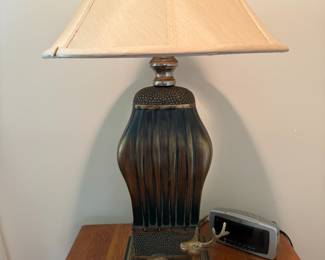 Ribbed bronze-tone table lamp with pair of brass deer figurines