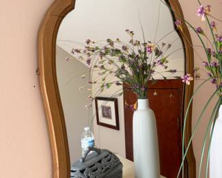 Carved wood arched wall mirror with scrolled crest