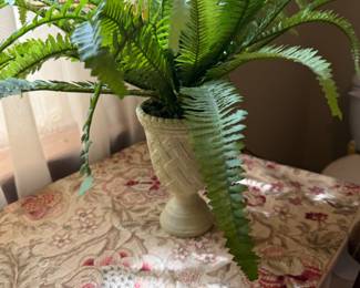 Artificial fern arrangement in carved pedestal urn planter