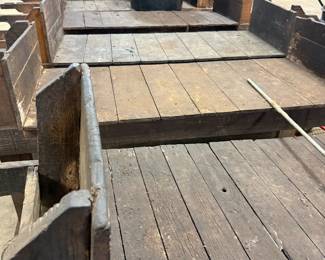Weathered wood flatbed wagon platforms with side rails