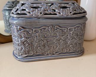 Blue ceramic reticulated lidded box with embossed floral scroll design