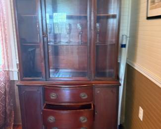 Mahogany china cabinet with glass doors and bowfront drawers