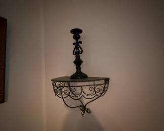 Wire scrollwork wall shelf with candlestick decor