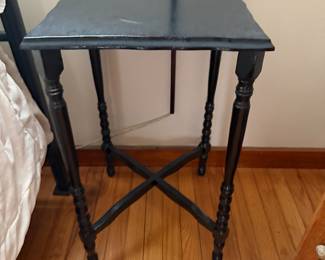 Black painted spindle leg side table with X stretcher