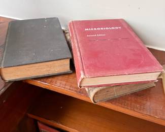 Vintage Microbiology Second Edition textbook with antique hardcover books