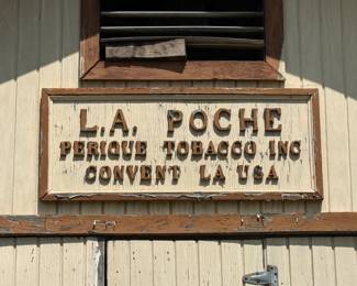 L.A. Poche Perique Tobacco Inc wooden building sign