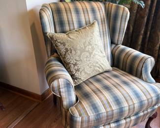 Plaid wingback armchair with ball and claw feet