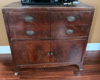 Antique mahogany chest with drawers over cabinet doors, brass pulls