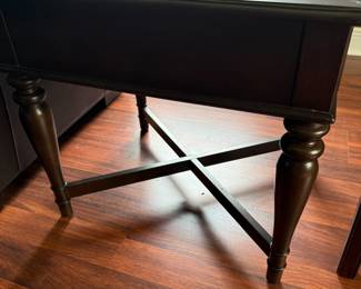 Dark wood side table with turned legs and X-stretcher base