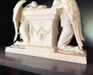 Weeping angels mourning statue kneeling at draped tomb altar