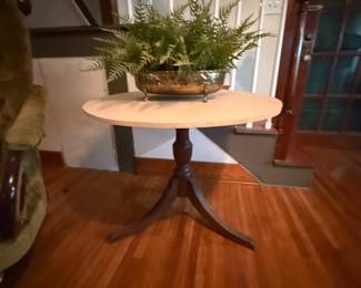 Round pedestal side table with tripod legs and marble-look top